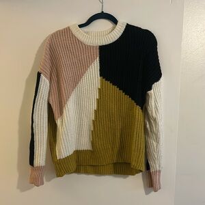 Black white pink and yellow color, black sweater. size large. Not see through!
